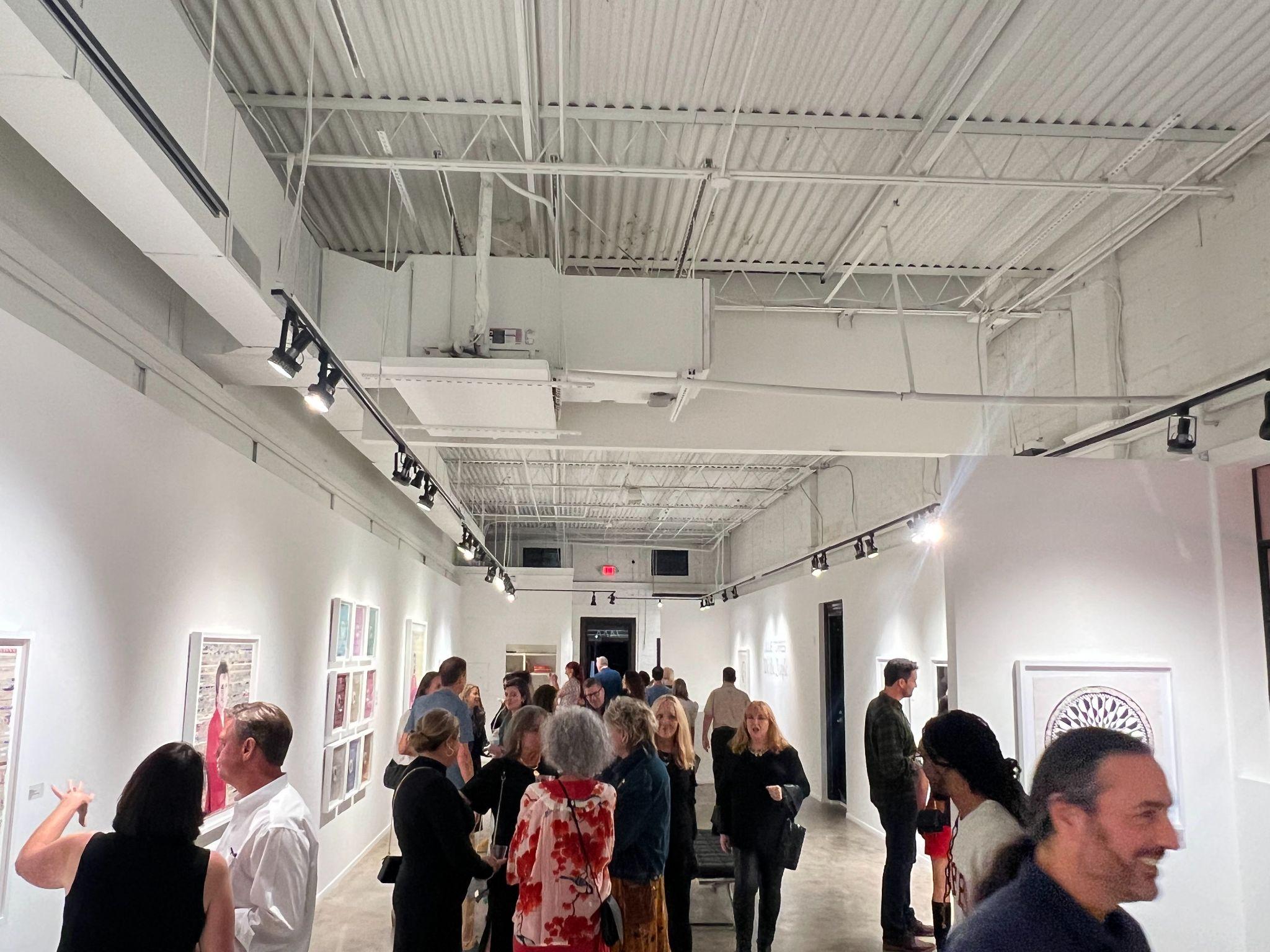 Opening night crowd inside an Atlanta gallery during Atlanta Art Week